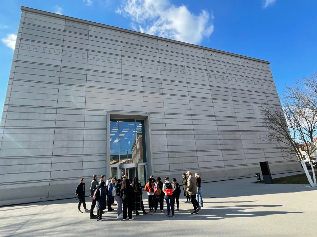 Bauhaus Museum front with class gathered around